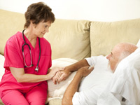 nurse bedside with patient