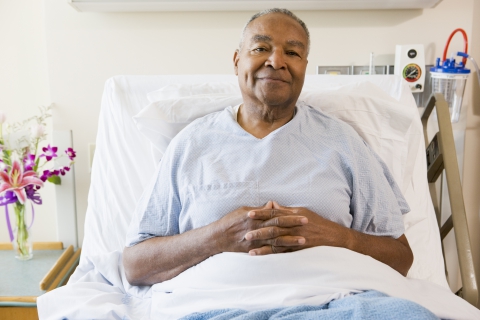 patient smiling in healthbed