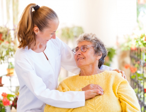 nurse and patient smiling