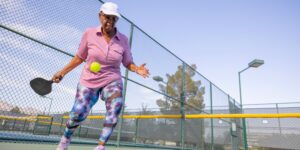 senior woman playing pickleball
